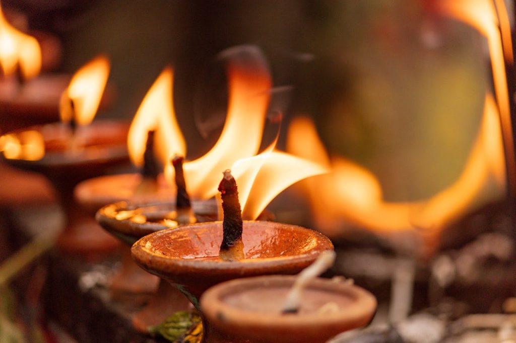 close-up-of-traditional-oil-lamps-with-flames-32834372